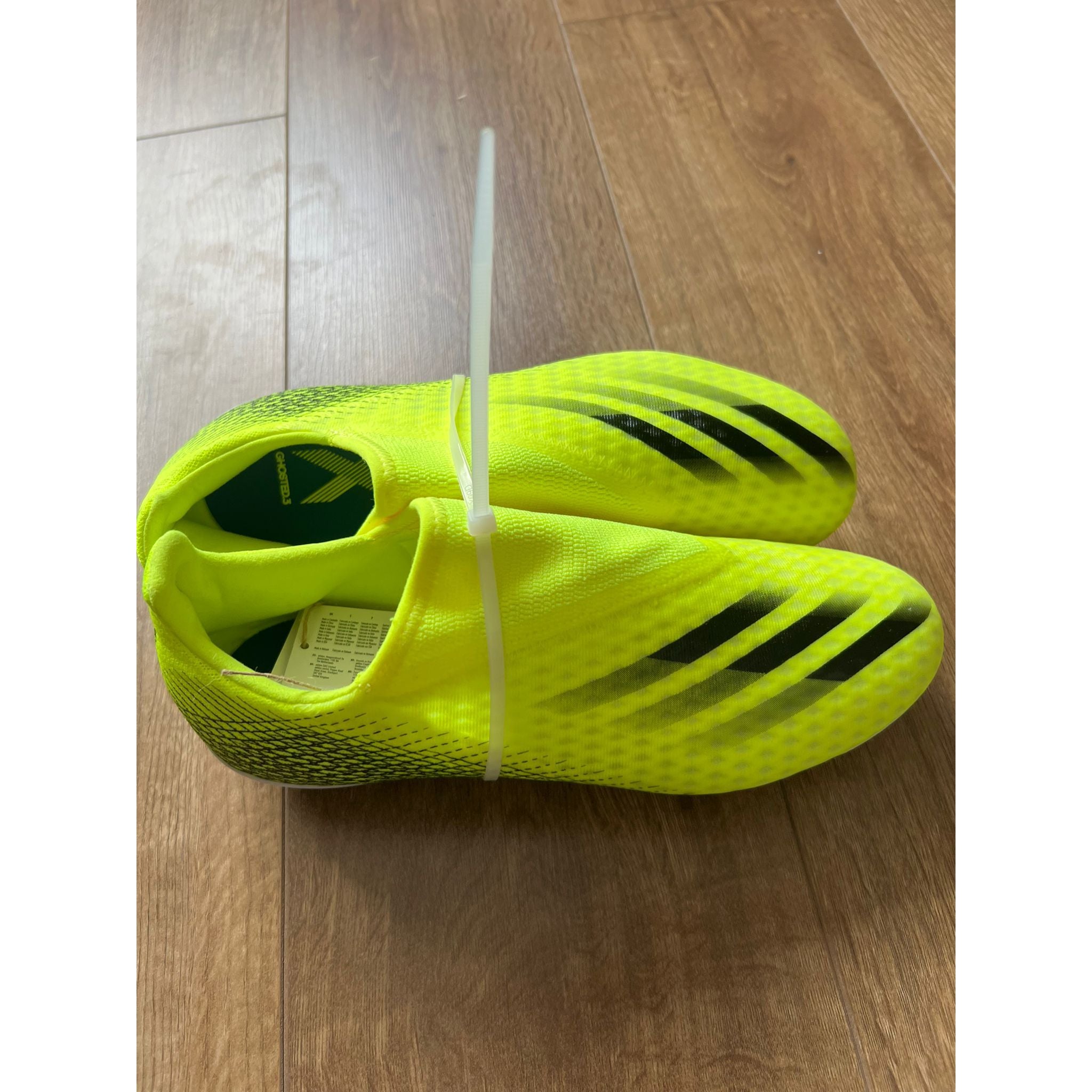 X Ghosted .3 Laceless Juniors Firm Ground Football Boots